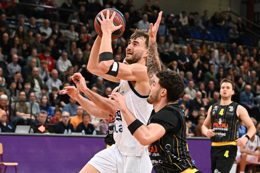 Oostende's Noam Yaacov and Limburg's Wout Leemans pictured in action during a basketball match between Limburg United and BC Oostende, Friday 13 February 2026 in Hasselt, on day 19 of the 'BNXT League' Belgian/ Dutch first division basket championship. BELGA PHOTO JILL DELSAUX