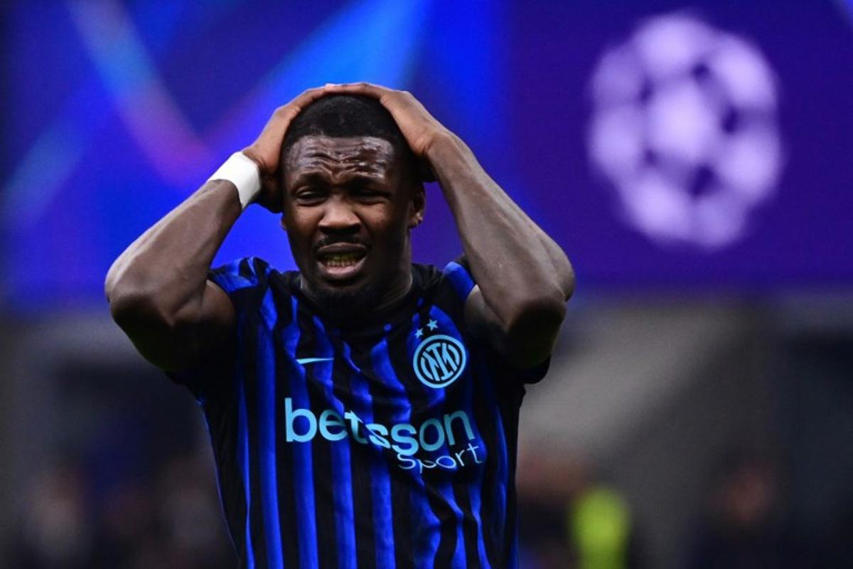 Inter Milan's French forward #09 Marcus Thuram reacts after a missing a goal opportunity during the UEFA Champions League second-leg play-off football match between Inter Milan and Bodo/Glimt at San Siro stadium in Milan, northern Italy, on February 24, 2026.   PIERO CRUCIATTI / AFP