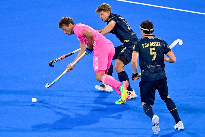 German Paul-Philipp Kaufmann; Belgium's Victor Wegnez and Belgium's Arno Van Dessel pictured in action during a hockey game between Belgian Lions and Germany, the second (out of three) matches during the group stage of the men's 2026 Hockey World Cup, Monday 17 August 2026 in Wavre. The 2026 edition of the Hockey World Cup takes place in Belgium and The Netherlands from August 15 to August 30. BELGA PHOTO DIRK WAEM