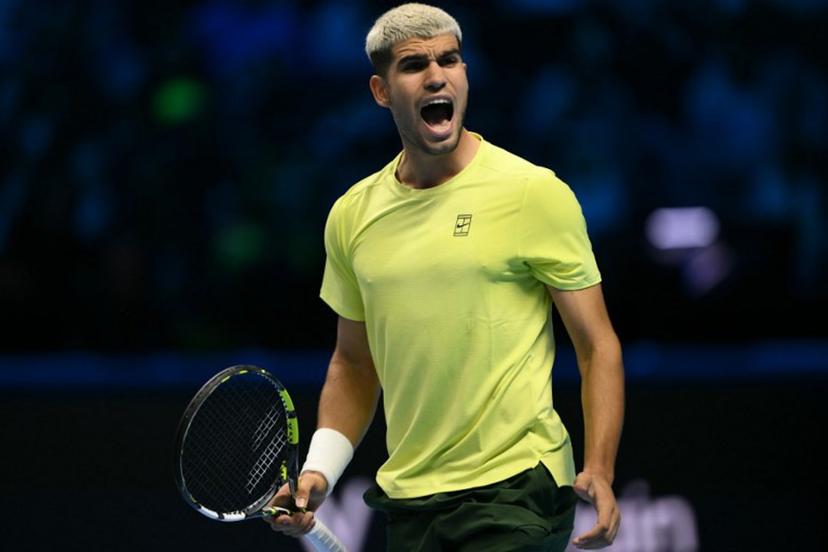 Spain's Carlos Alcaraz celebrates after winning his match against Australia's Alex De Minaur at the ATP Finals tennis tournament in Turin on November 9, 2025.  Marco BERTORELLO / AFP