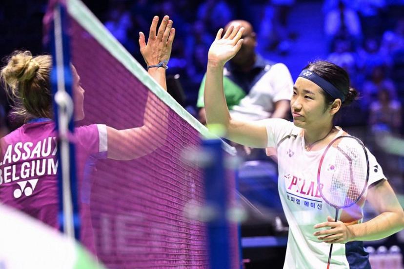 South Korea's An Se-young (R) taps hands with Belgium's Clara Lassaux after winning their women's singles match at the badminton BWF World Championships at the Adidas Arena in Paris, on August 25, 2025.  Bertrand GUAY / AFP