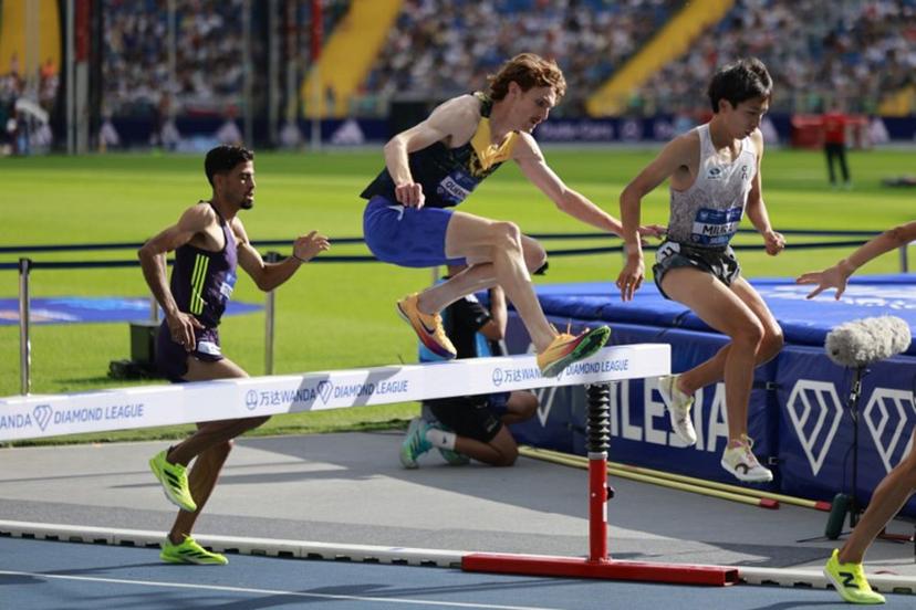 Japan's Ryuji Miura (R), Luxembourg's Ruben Querinjean (C) and Marocco's Mohamed Tindouft (L) compete in the 3000 m Steeple Chase competition of the Silesia Diamond League athletics meeting in Katowice, Poland, on August 23, 2026.  Wojtek RADWANSKI / AFP