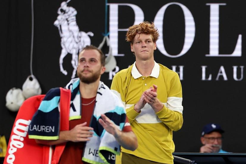 Italy's Jannik Sinner (L) applauds France's Hugo Gaston as Gaston walks off the court following their men's singles match on day three of the Australian Open tennis tournament in Melbourne on January 20, 2026.  Martin KEEP / AFP