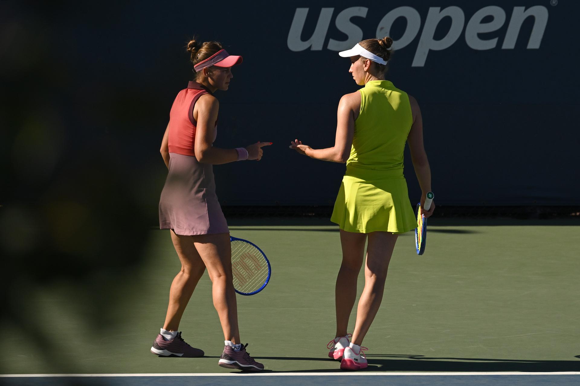 Belgian Elise Mertens (yellow) and Veronika Kudermetova (pink) pictured during a tennis match against US pair Brantmeier-Hamilton, in the second round of the women's doubles of the 2025 US Open Grand Slam tennis tournament in New York City, USA, Saturday 30 August 2025. BELGA PHOTO TONY BEHAR