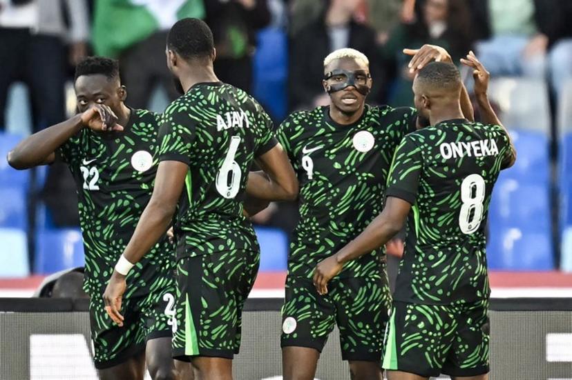 Nigeria's forward #09 Victor Osimhen (2R) celebrates scoring his team's first goal during the Africa Cup of Nations (CAN) quarter-final football match between Algeria and Nigeria at the Grand stadium in Marrakesh on January 10, 2026.   Paul ELLIS / AFP