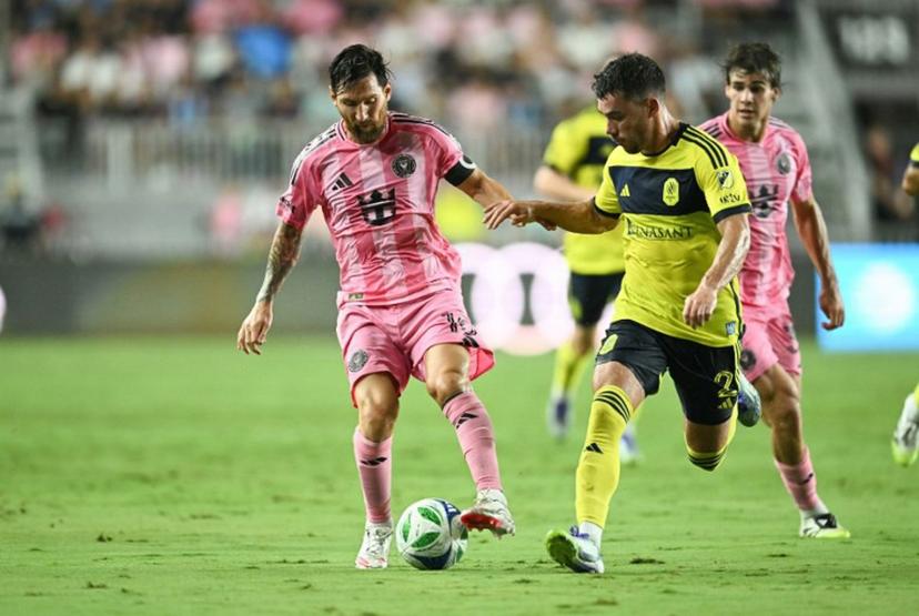 Inter Miami's Argentine forward #10 Lionel Messi and Nashville's US defender #02 Daniel Lovitz vie for the ball during the Major League Soccer (MLS) regular season soccer match between Inter Miami CF and Nashville SC at Chase Stadium in Fort Lauderdale, Florida on July 12, 2025.  CHANDAN KHANNA / AFP