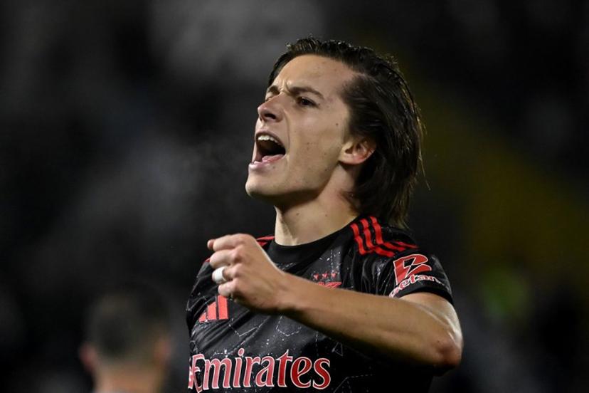 Benfica's Spanish defender #03 Alvaro Fernandez Carreras celebrates after scoring during the Portuguese League football match between Vitoria Guimaraes SC and SL Benfica at the Dom Afonso Henriques stadium in Guimaraes, Portugal, on April 19, 2025.  MIGUEL RIOPA / AFP