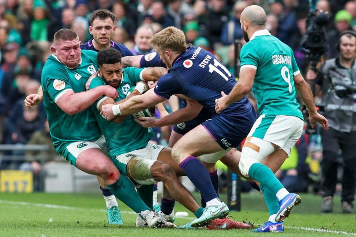 Ireland's wing Robert Baloucoune in action on the ball during the Six Nations international rugby union match between Ireland and Scotland at the Aviva Stadium in Dublin, on March 14, 2026.  Paul Faith / AFP