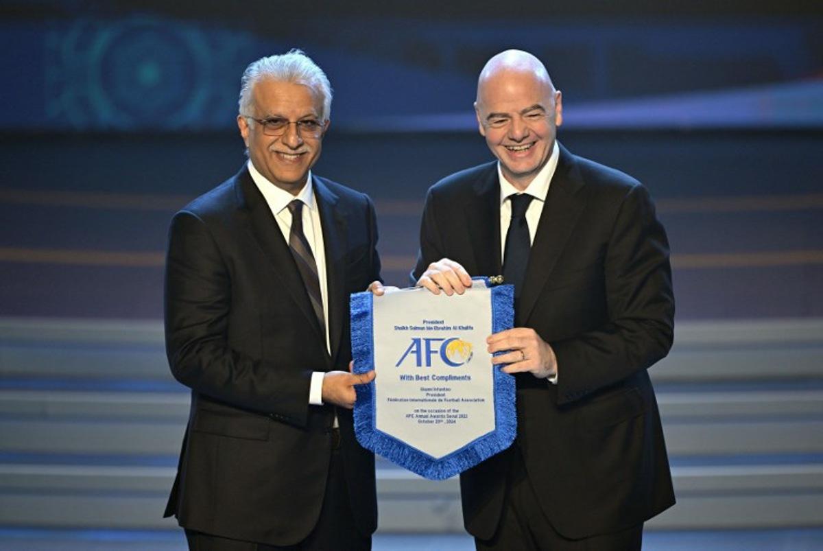 FIFA president Gianni Infantino (R) poses with Sheikh Salman bin Ibrahim al-Khalifa (L), president of the Asian Football Confederation (AFC), during the AFC Annual Awards 2023 ceremony in Seoul on October 29, 2024.  JUNG YEON-JE / AFP