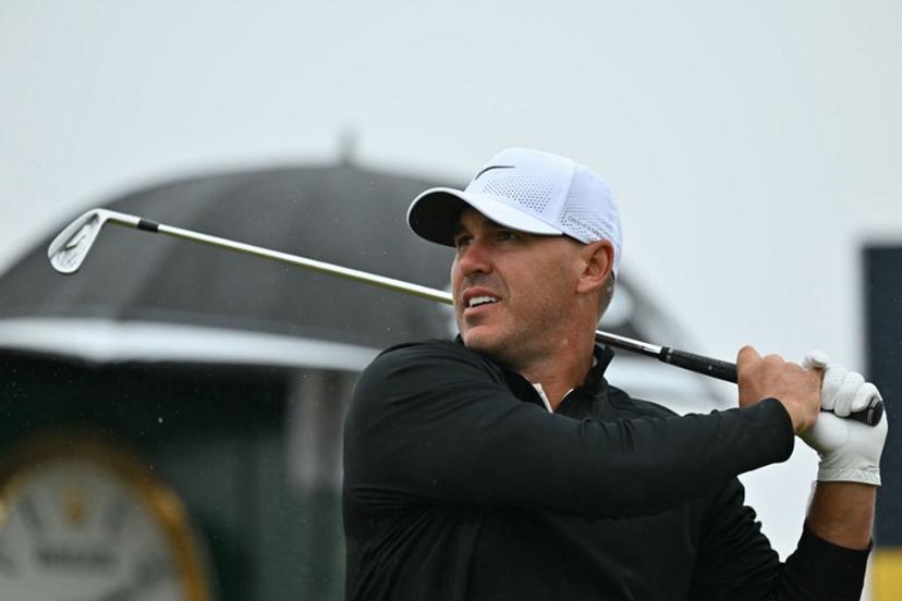 US golfer Brooks Koepka watches his iron shot from the 3rd tee during his third round, on day three of the 152nd British Open Golf Championship at Royal Troon on the south west coast of Scotland on July 20, 2024.  Glyn KIRK / AFP