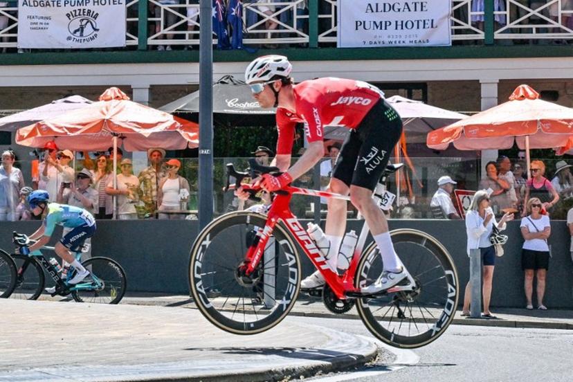 Jayco AlUla rider Mauro Schmid from Switzerland jumps over a kerb in Aldgate during stage five of the Tour Down Under UCI Men's Cycling in Adelaide on January 25, 2026.  Brenton Edwards / AFP