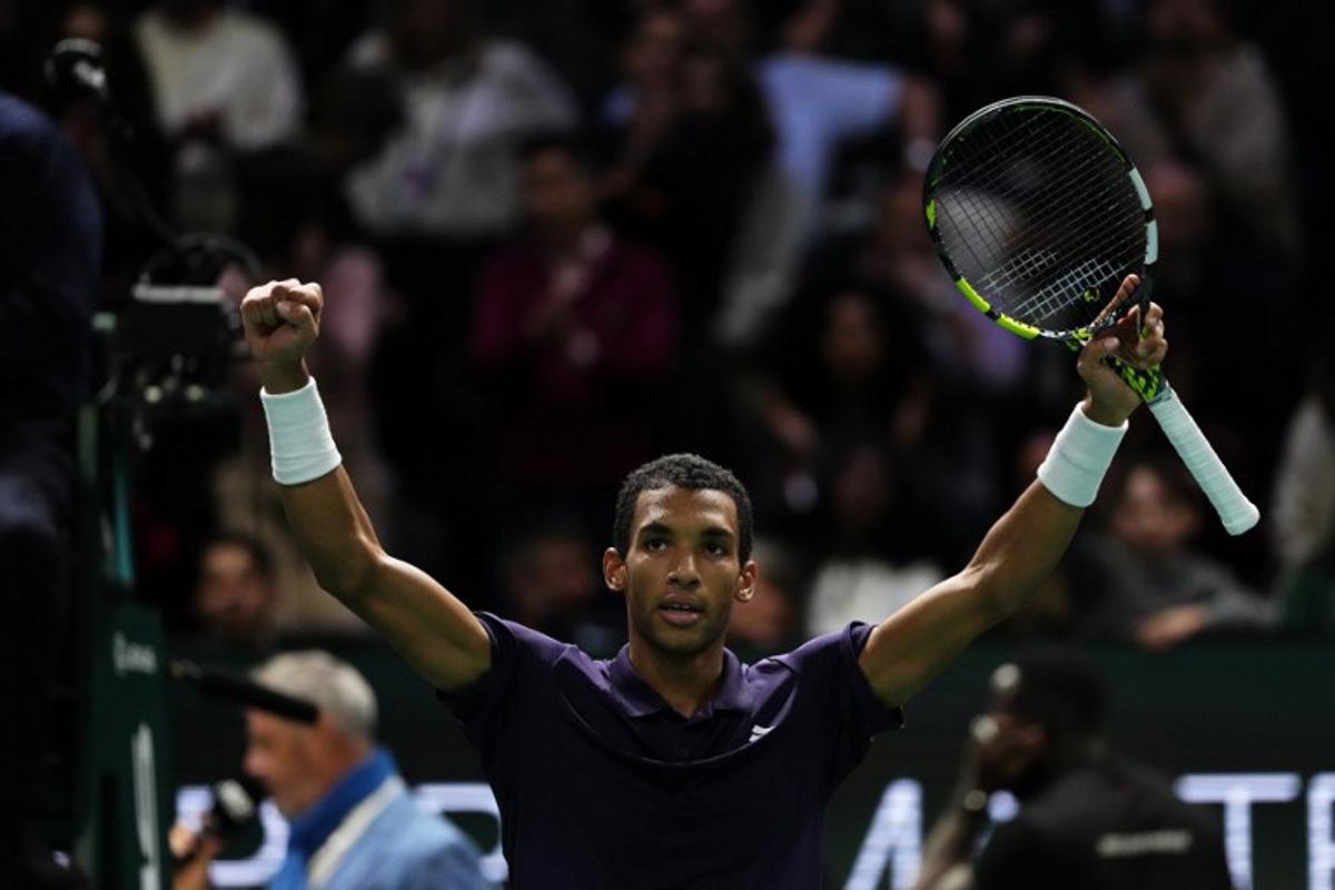 Canada's Felix Auger-Aliassime celebrates after winning against Monaco's Valentin Vacherot following their men's singles quarter-final match on day five of the Paris ATP Masters 1000 tennis tournament at the Paris La Défense Arena in Nanterre, on the outskirts of Paris, on October 31, 2025.  Dimitar DILKOFF / AFP
