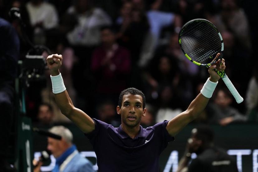 Canada's Felix Auger-Aliassime celebrates after winning against Monaco's Valentin Vacherot following their men's singles quarter-final match on day five of the Paris ATP Masters 1000 tennis tournament at the Paris La Défense Arena in Nanterre, on the outskirts of Paris, on October 31, 2025.  Dimitar DILKOFF / AFP