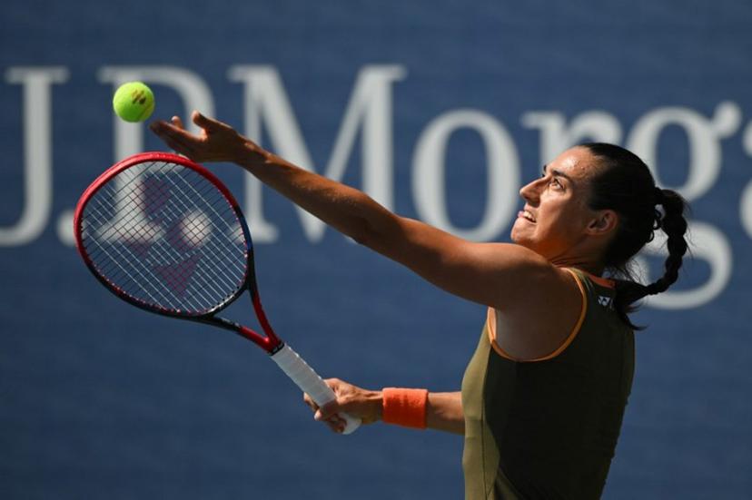 France's Caroline Garcia serves to Russia's Kamilla Rakhimova during their women's singles first round tennis match on day two of the US Open tennis tournament at the USTA Billie Jean King National Tennis Center in New York City, on August 25, 2025.  ANGELA WEISS / AFP