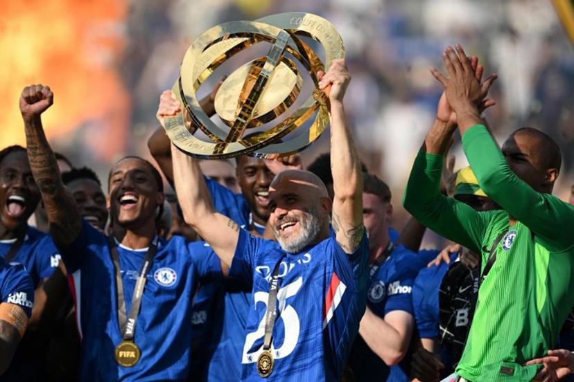 Chelsea's Italian head coach Enzo Maresca lifts the trophy with teammates during the award ceremony for the FIFA Club World Cup 2025 Champions, following the final football match between England's Chelsea and France's Paris Saint-Germain at the MetLife Stadium in East Rutherford, New Jersey on July 13, 2025.  ANGELA WEISS / AFP