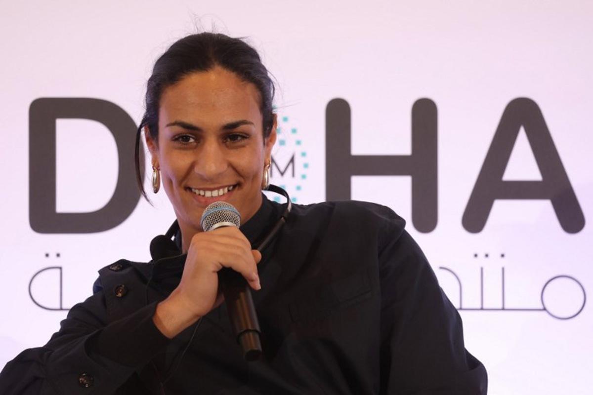 Algerian gold medallist boxer Imane Khelif speaks during the Doha Forum in the Qatari capital on December 7, 2024.  KARIM JAAFAR / AFP