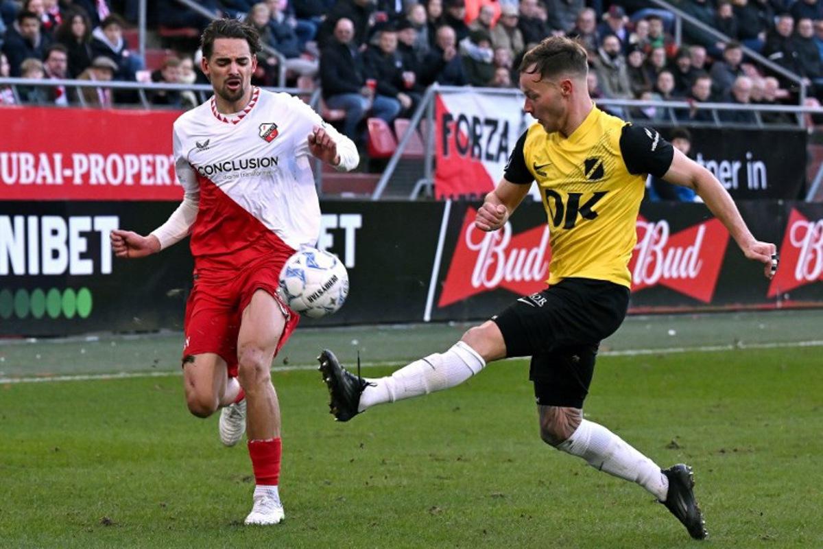 Utrecht's Belgian defender #02 Siebe Horemans (L) and Breda's Dutch defender #02 Boyd Lucassen fight for the ball during the Dutch Eredivisie first division football match between FC Utrecht and NAC Breda at the Galgenwaard stadium in Utrecht in Utrecht on March 1, 2025.  Gerrit van Keulen / ANP / AFP