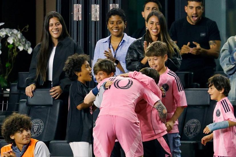 Inter Miami's Argentine forward #10 Lionel Messi hugs family as wife Antonela Roccuzzo looks on as he celebrates after scoring a goal in the second half of the CONCACAF Champions Cup Quartefinal football match between Inter Miami and LAFC at Chase Stadium in Fort Lauderdale, Florida on April 9, 2025.  Chris Arjoon / AFP