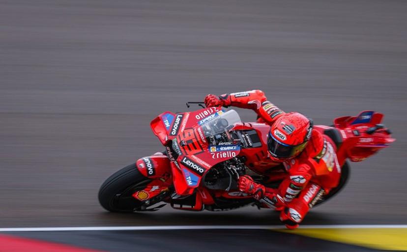Ducati Lenovo Team's Spanish MotoGP rider Marc Marquez steers his bike during the third practice session of the MotoGP German motorcycle Grand Prix at the Sachsenring racing circuit, in Hohenstein-Ernstthal near Chemnitz, eastern Germany on July 12, 2025.  Ronny Hartmann / AFP