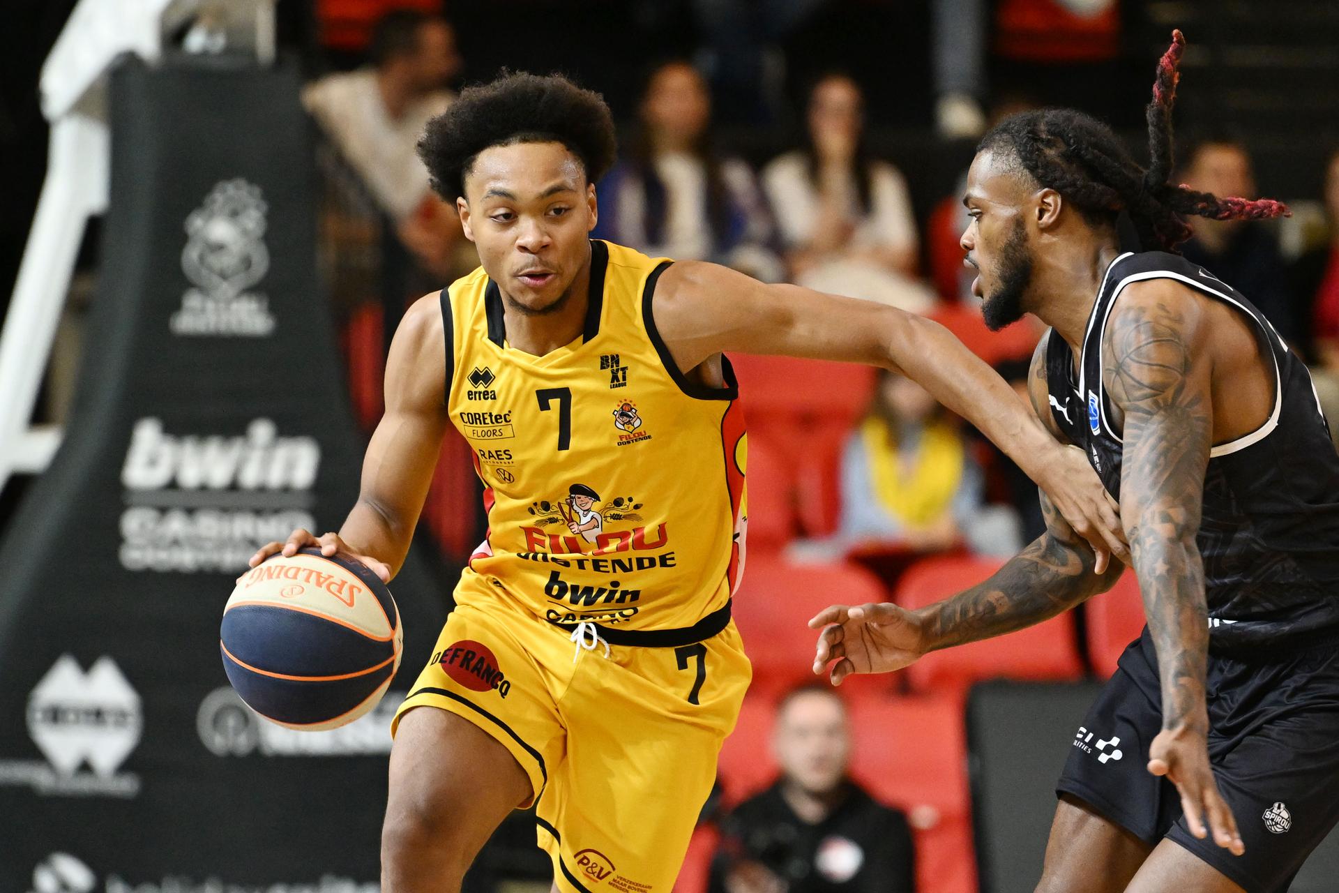 Oostende's Corentin Efono and Spirou's Cobe Williams fight for the ball during a basketball match between BC Oostende and Spirou Charleroi, Saturday 14 September 2024 in Oostende, on day 1 of the 'BNXT League' Belgian/ Dutch first division basket championship. BELGA PHOTO MAARTEN STRAETEMANS