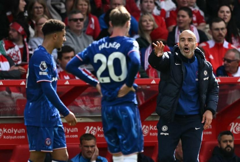 Chelsea's Italian head coach Enzo Maresca (R) reacts at Chelsea's English midfielder #20 Cole Palmer during the English Premier League football match between Nottingham Forest and Chelsea at The City Ground in Nottingham, central England, on May 25, 2025.  Ben STANSALL / AFP
