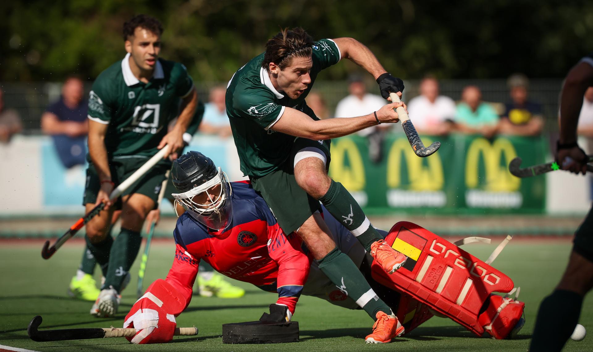 Dragons' Frederic Beeckman and WatDucks' Francois Sior fight for the ball during a hockey game between Watducks and Dragons, Sunday 28 September 2025 in Waterloo, in the fifth day of the Belgian Hockey League men 2025-2026 season. BELGA PHOTO VIRGINIE LEFOUR