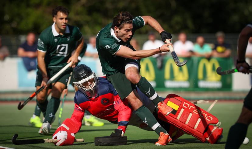 Dragons' Frederic Beeckman and WatDucks' Francois Sior fight for the ball during a hockey game between Watducks and Dragons, Sunday 28 September 2025 in Waterloo, in the fifth day of the Belgian Hockey League men 2025-2026 season. BELGA PHOTO VIRGINIE LEFOUR