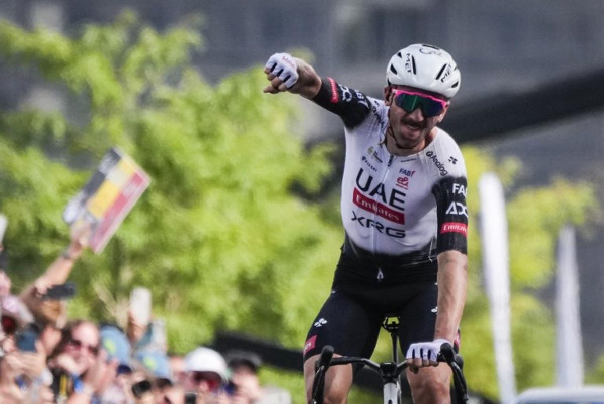 American Brandon McNulty, of UAE Team Emirates XRG, crosses the finish line during the 14th Grand Prix Cycliste de Montreal cycling road race in Montreal, Canada, on September 14, 2025.   MATHIEU BELANGER / AFP