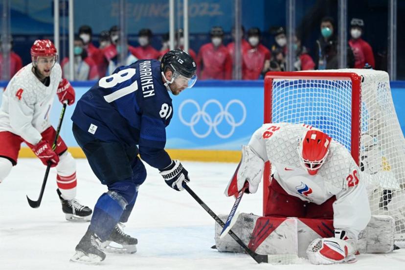 Finland's Iiro Pakarinen (C) shoots the puck as Russian Olympic Committee's goaltender Ivan Fedotov (R) defends the goal during the men's gold medal match of the Beijing 2022 Winter Olympic Games ice hockey competition between Finland and Russia's Olympic Committee, at the National Indoor Stadium in Beijing on February 20, 2022.  Kirill KUDRYAVTSEV / AFP