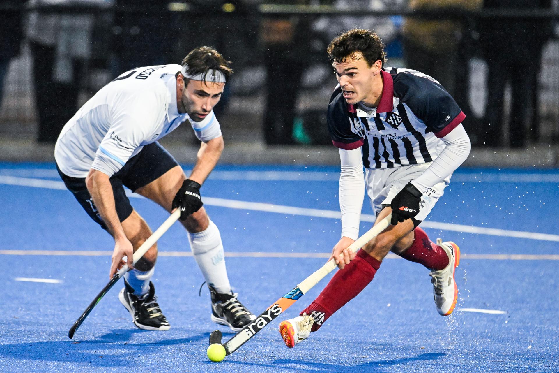Oree's Luca Masso and Herakles Xavier Gispert pictured in action during a hockey game between Herakles and Oree, Sunday 16 November 2025 in Lier, on day 12 of the Belgian first division hockey championship. BELGA PHOTO TOM GOYVAERTS
