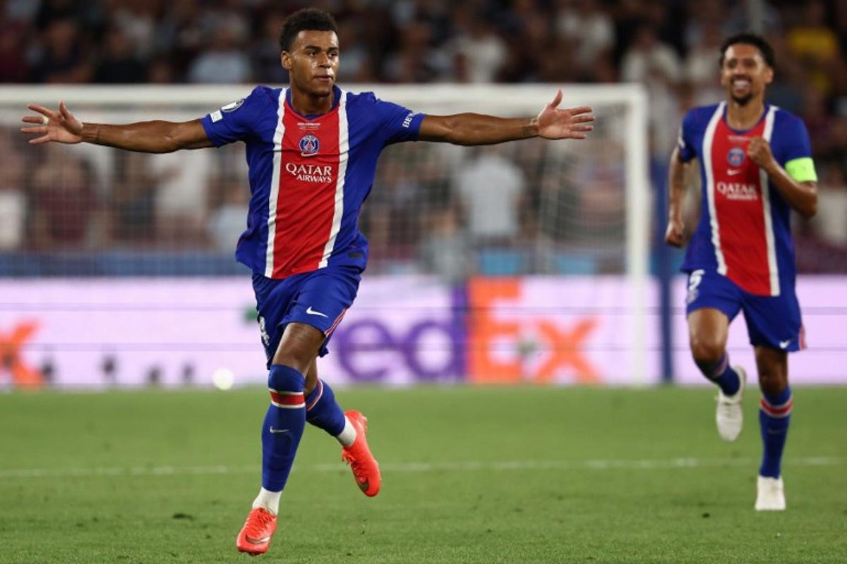 Paris Saint-Germain's French midfielder #14 Desire Doue celebrates scoring the 2-1 goal with his teammates during the UEFA Supercup football match between Champions League winners Paris Saint Germain (PSG) and Europa League winners Aston Villa in Salzburg, Austria on August 12, 2026.  FRANCK FIFE / AFP