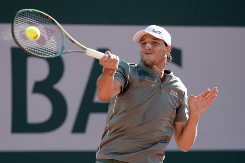 Italy's Luciano Darderi plays a forehand return to Austria's Sebastian Ofner during their men's singles match on day 3 of the French Open tennis tournament at the Roland-Garros Complex in Paris on May 26, 2026.  Dimitar DILKOFF / AFP