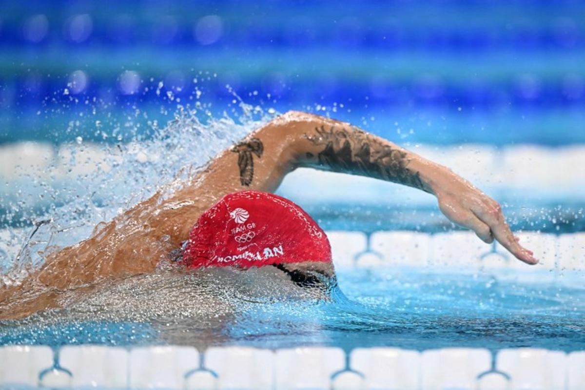 Britain's Jack Mcmillan competes in a heat of the men's 4x200m freestyle relay swimming event during the Paris 2024 Olympic Games at the Paris La Defense Arena in Nanterre, west of Paris, on July 30, 2024.  SEBASTIEN BOZON / AFP