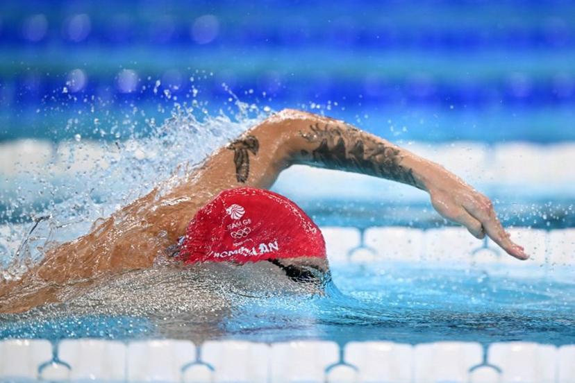 Britain's Jack Mcmillan competes in a heat of the men's 4x200m freestyle relay swimming event during the Paris 2024 Olympic Games at the Paris La Defense Arena in Nanterre, west of Paris, on July 30, 2024.  SEBASTIEN BOZON / AFP