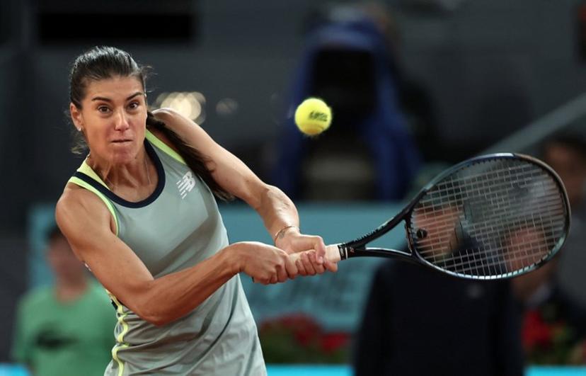 Romania's Sorana Cirstea returns the ball to Poland's Iga Swiatek during their second round of the 2024 WTA Tour Madrid Open tournament tennis match at Caja Magica in Madrid on April 27, 2024.  Thomas COEX / AFP