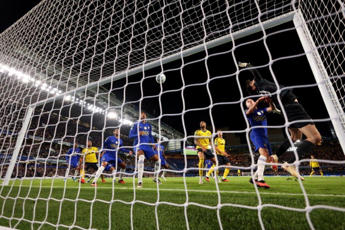 Chelsea's Belgian goalkeeper #39 Mike Penders concedes the teams first goal during the English League Cup third round football match between Chelsea and Leeds United at Stamford Bridge, in London on September 9, 2026.  Adrian DENNIS / AFP