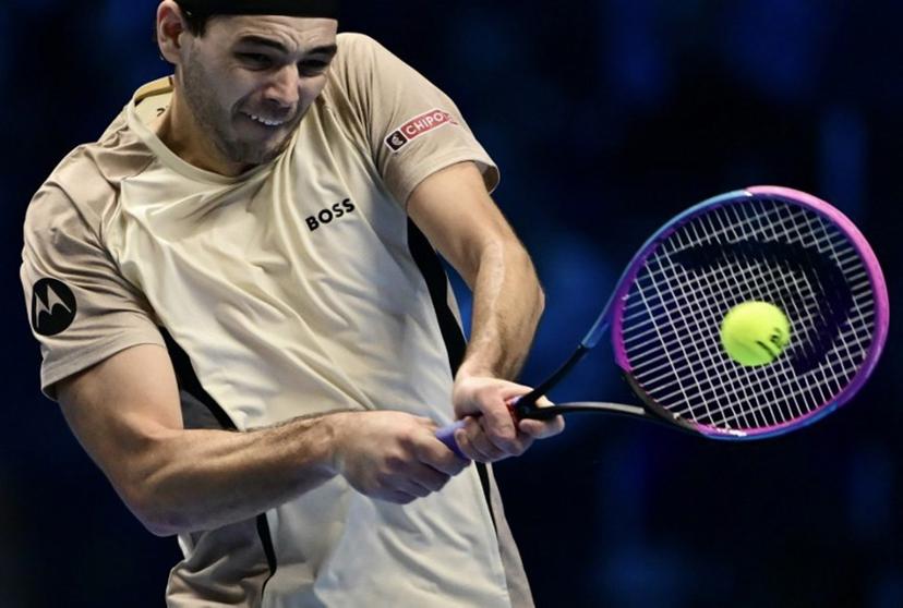 USA's Taylor Fritz plays a backhand return against Italy's Lorenzo Musetti during the ATP Finals tennis tournament in Turin on November 10, 2025. bac Marco BERTORELLO / AFP