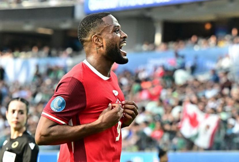 Canada's forward #09 Cyle Larin celebrates at the conclusion of the CONCACAF Nations League third place final football match between USA and Canada at SoFi Stadium in Inglewood, California, on March 23, 2025. Canada finishes third in the 2024-25 CONCACAF Nations League after earning a 2-1 victory over the USA. Frederic J. Brown / AFP