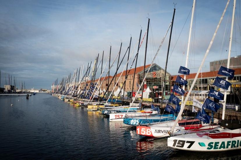 This aerial photograph shows sailboats moored in the docks before the start of the Transat Cafe l'OR (former Transat Jacques Vabre) duo sailing race from Le Havre to Fort-de-France, in Le Havre, north-western France, on October 22, 2025. The MOCA, Ocean Fifty, ULTIM, and Class40 boats will take the start of the race on October 26, 2025.  Lou BENOIST / AFP