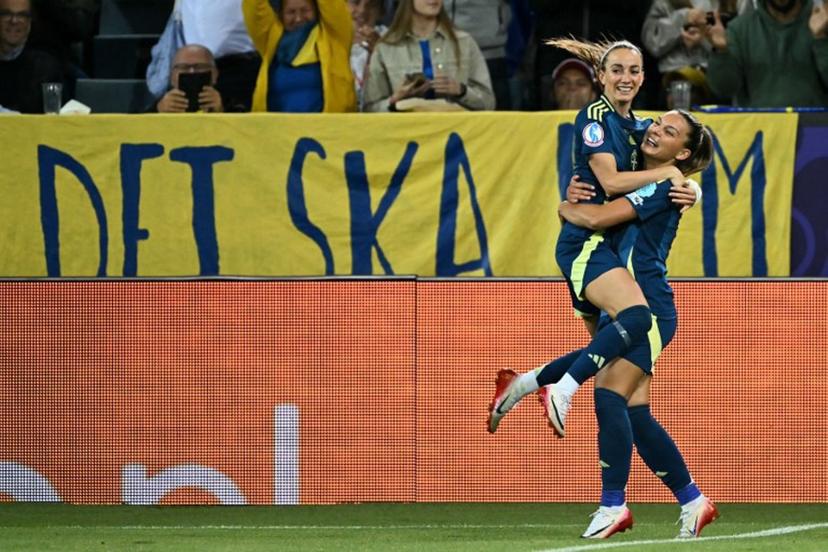 Sweden's forward #09 Kosovare Asllani (L) celebrates with Sweden's forward #19 Johanna Rytting Kaneryd (R) after scoring Sweden's second goal during the UEFA Women's Euro 2025 Group C football match between Poland and Sweden at the Allmend Stadion Luzern in Lucerne on July 8, 2025.  Fabrice COFFRINI / AFP