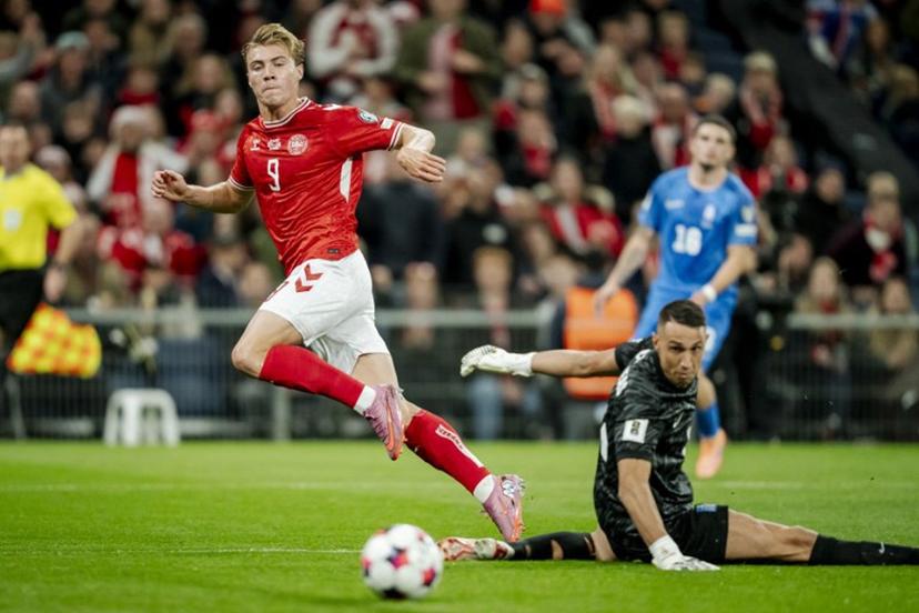 Denmark's forward #09 Rasmus Hojlund scores his team's first goal during the 2026 World Cup qualifiers Europe zone group G football match between Denmark and Greece on October 12, 2025 in Copenhagen.   Mads Claus Rasmussen / Ritzau Scanpix / AFP