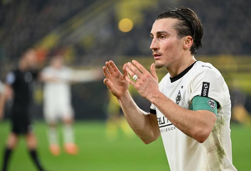 Moenchengladbach's German midfielder #27 Rocco Reitz reacts during the German first division Bundesliga football match between Borussia Dortmund and Borussia Moenchengladbach in Dortmund on December 19, 2025.  UWE KRAFT / AFP