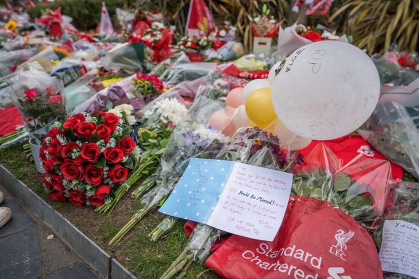 Messages, flowers, scarves and shirts are seen at a memorial set up close to Anfield football ground for their Portuguese forward Diogo Jota in Liverpool, north-west England July 4, 2025. Liverpool striker Diogo Jota died along with his brother early July 3, 2025 in a road accident in northwest Spain, the Spanish Civil Guard said. The accident occurred on a highway in the province of Zamora. The vehicle "left the road" before bursting into flames, the Civil Guard said, adding that the two passengers, Diogo Jota and his brother Andre Felipe, also a professional footballer, were deceased. Mark NAFTALIN / AFP