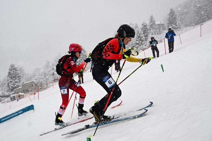 Switzerland's Caroline Ulrich (L) and Germany's Tatjana Paller compete in the women's sprint ski mountaineering semi-final 1 heat 2 during the Milano Cortina 2026 Winter Olympic Games at the Stelvio Ski Centre in Bormio (Valtellina) on February 19, 2026.  Fabrice COFFRINI / AFP