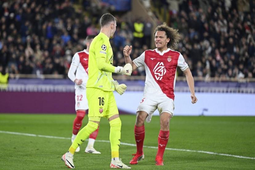 Monaco's Belgian defender #25 Wout Faes reacts after Monaco's Swiss goalkeeper #16 Philipp Kohn (L) stopped a penalty during the UEFA Champions League knockout round play-off first leg football match between AS Monaco and Paris Saint-Germain at the Stade Louis II in the Principality of Monaco on February 17, 2026.  Frederic Dides / AFP