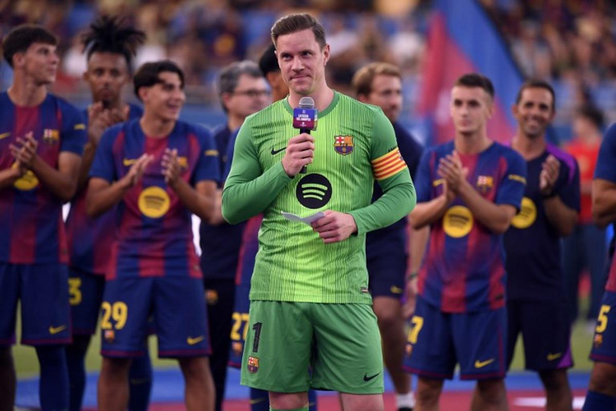Barcelona's German goalkeeper Marc-Andre Ter Stegen delivers a speech before the 60th Joan Gamper Trophy football match between FC Barcelona and Como 1907 at Johan Cruyff Stadium in Barcelona on August 10, 2025.  Josep LAGO / AFP