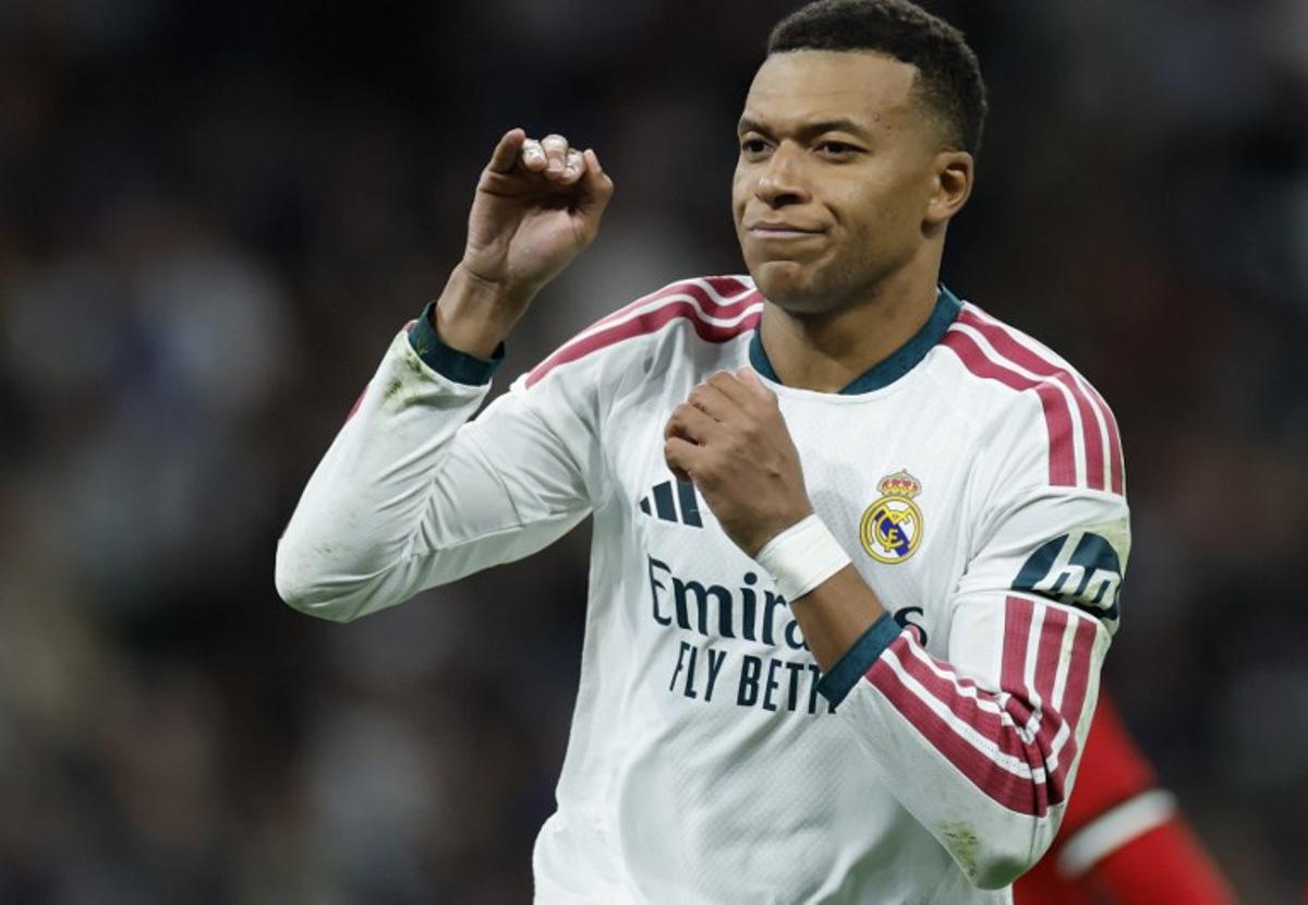 Real Madrid's French forward #10 Kylian Mbappe celebrates scoring his team's third goal from the penalty spot during the Spanish league football match between Real Madrid CF and Sevilla FC at the Santiago Bernabeu stadium in Madrid on October 18, 2026.  Oscar DEL POZO / AFP