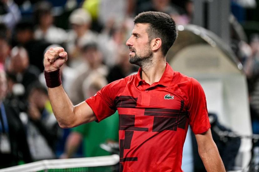 Serbia's Novak Djokovic celebrates after his victory against USA's Taylor Fritz at their men's singles semi-final match during the Shanghai Masters tennis tournament in Shanghai on October 12, 2024.  HECTOR RETAMAL / AFP