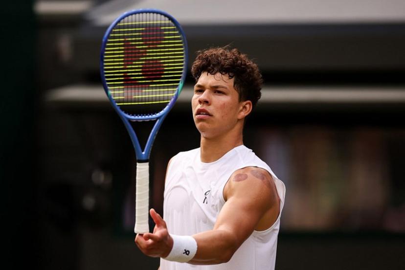 US player Ben Shelton plays with his racquet during his men's singles quarter-final tennis match against Italy's Jannik Sinner on the tenth day of the 2025 Wimbledon Championships at The All England Lawn Tennis and Croquet Club in Wimbledon, southwest London, on July 9, 2025.  HENRY NICHOLLS / AFP