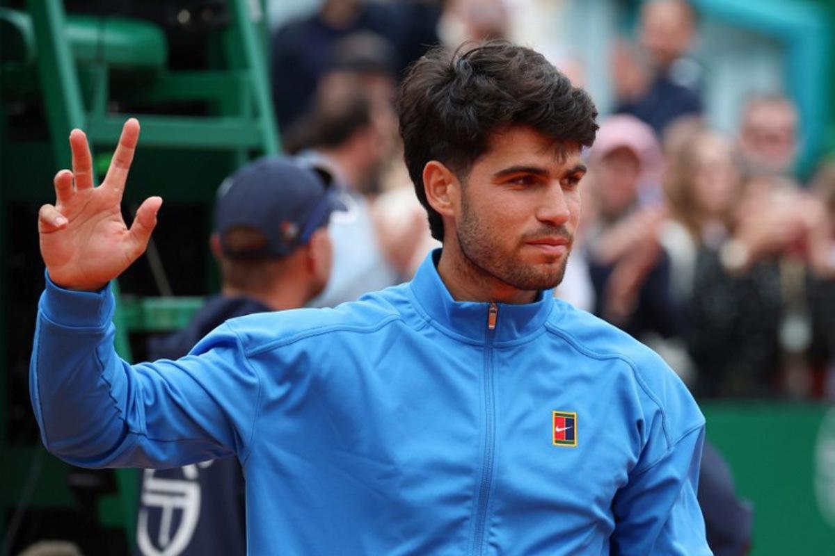 Spain's Carlos Alcaraz gestures after the Monte Carlo ATP Masters Series Tournament final tennis match against Italy's Jannik Sinner on Court Rainier III at the Monte-Carlo Country Club in Roquebrune-Cap-Martin, south-eastern France on April 12, 2026.  Valery HACHE / AFP